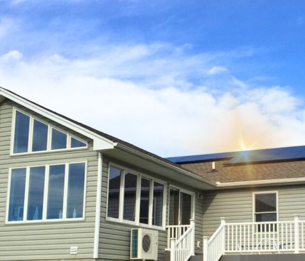 House with big windows and solar panels